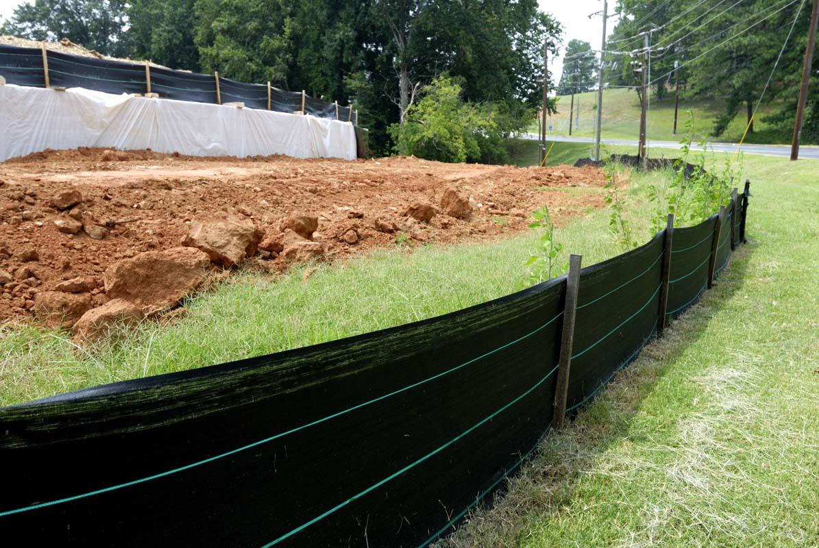 Silt Fence installed beside disturbed soil.